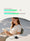 Woman reading a book while charging pixel watch with SwanScout charger